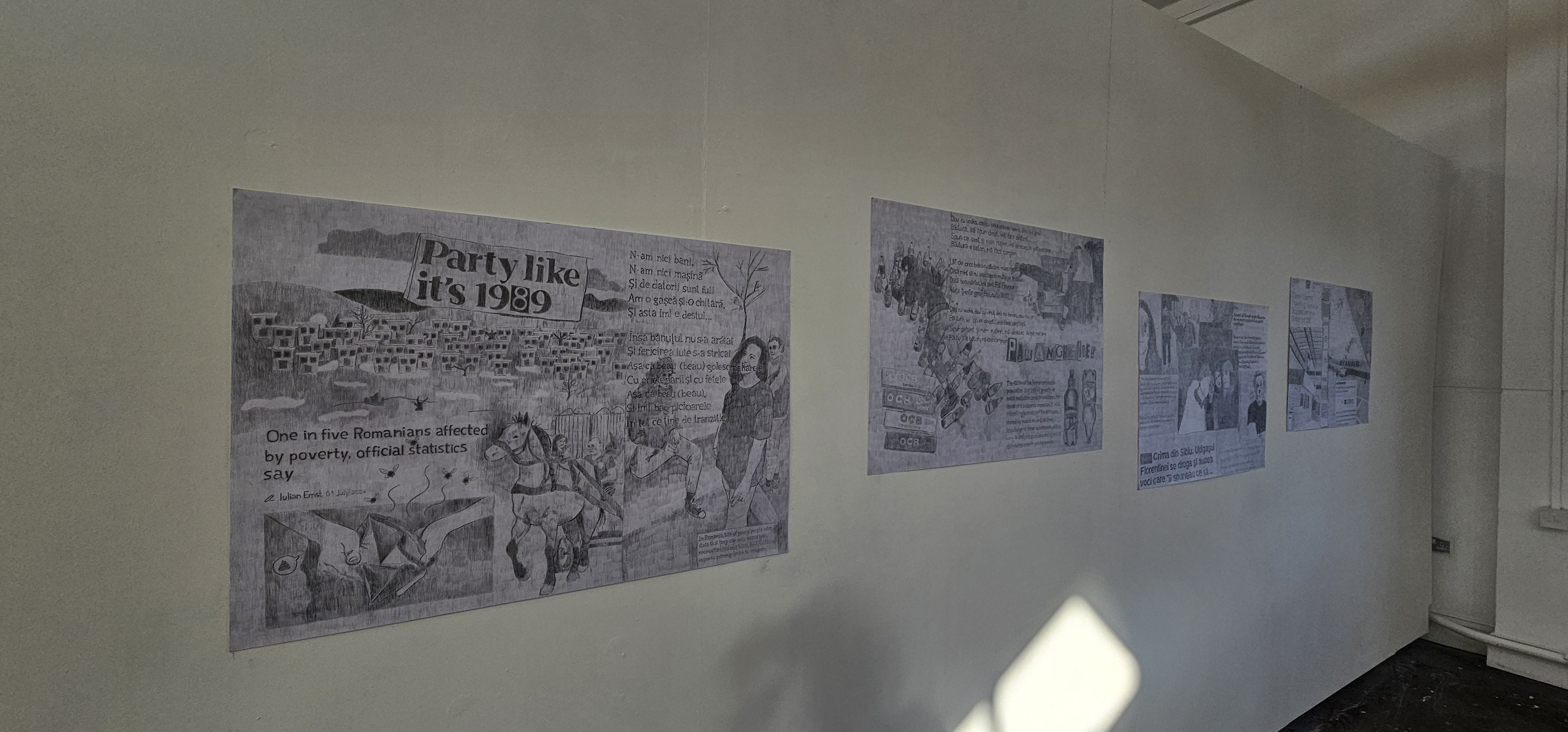 A wall containing four graphite pieces