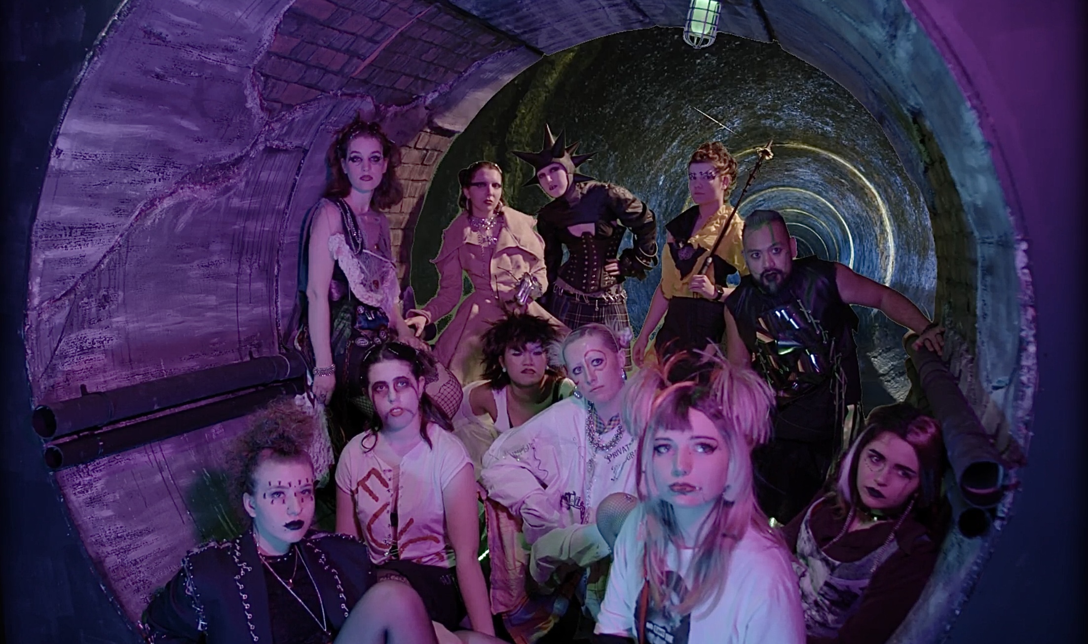 Shot of the actors sitting in the tunnel.