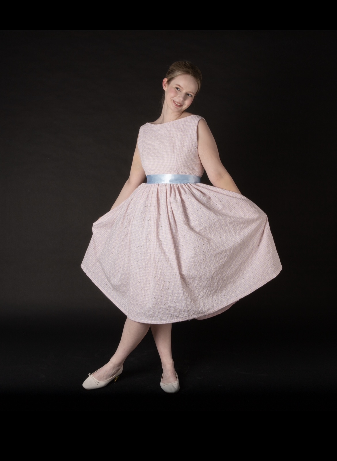 Lara NiBhrian modeling the character "Amber" from "Hairspray"