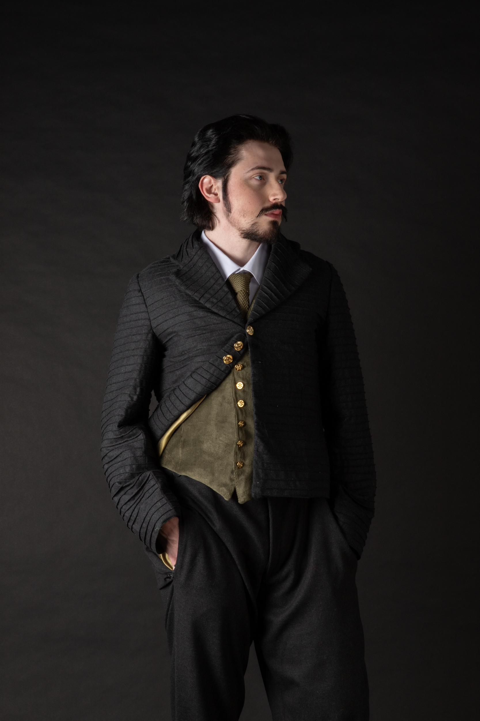 Oran O’Reilly as Robert Olmstead in, “The Shadow Over Innsmouth”. This costume depicts Olmstead as he arrives to the town of Innsmouth, wearing a morning suit accurate to those of the 1890’s. Photography by Sarah Lordan. Hair and makeup by Lavender Jane Gartlan. 