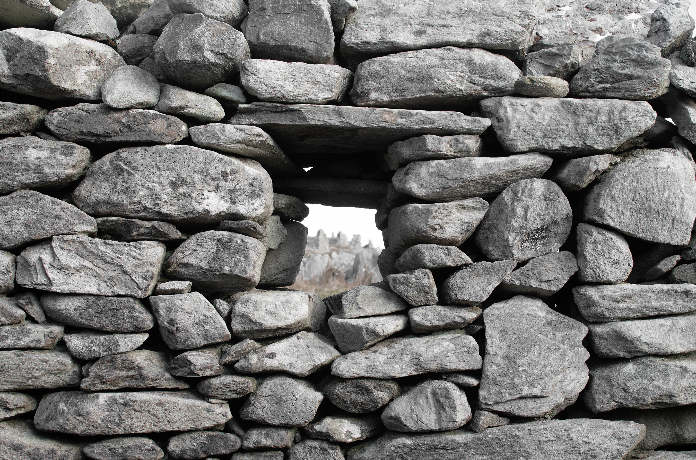 A stone wall with an opening for a window
