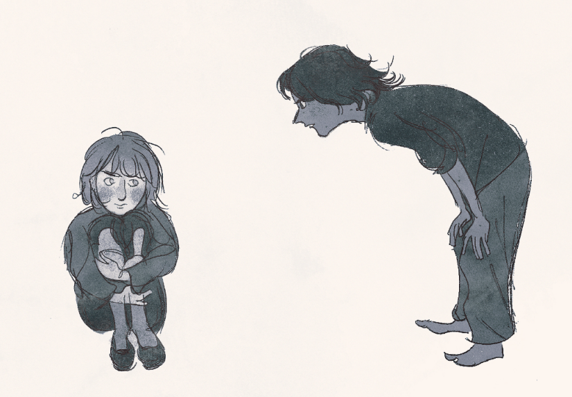 A young boy stares in an accusatory fashion at a young girl, who is sitting on the floor.