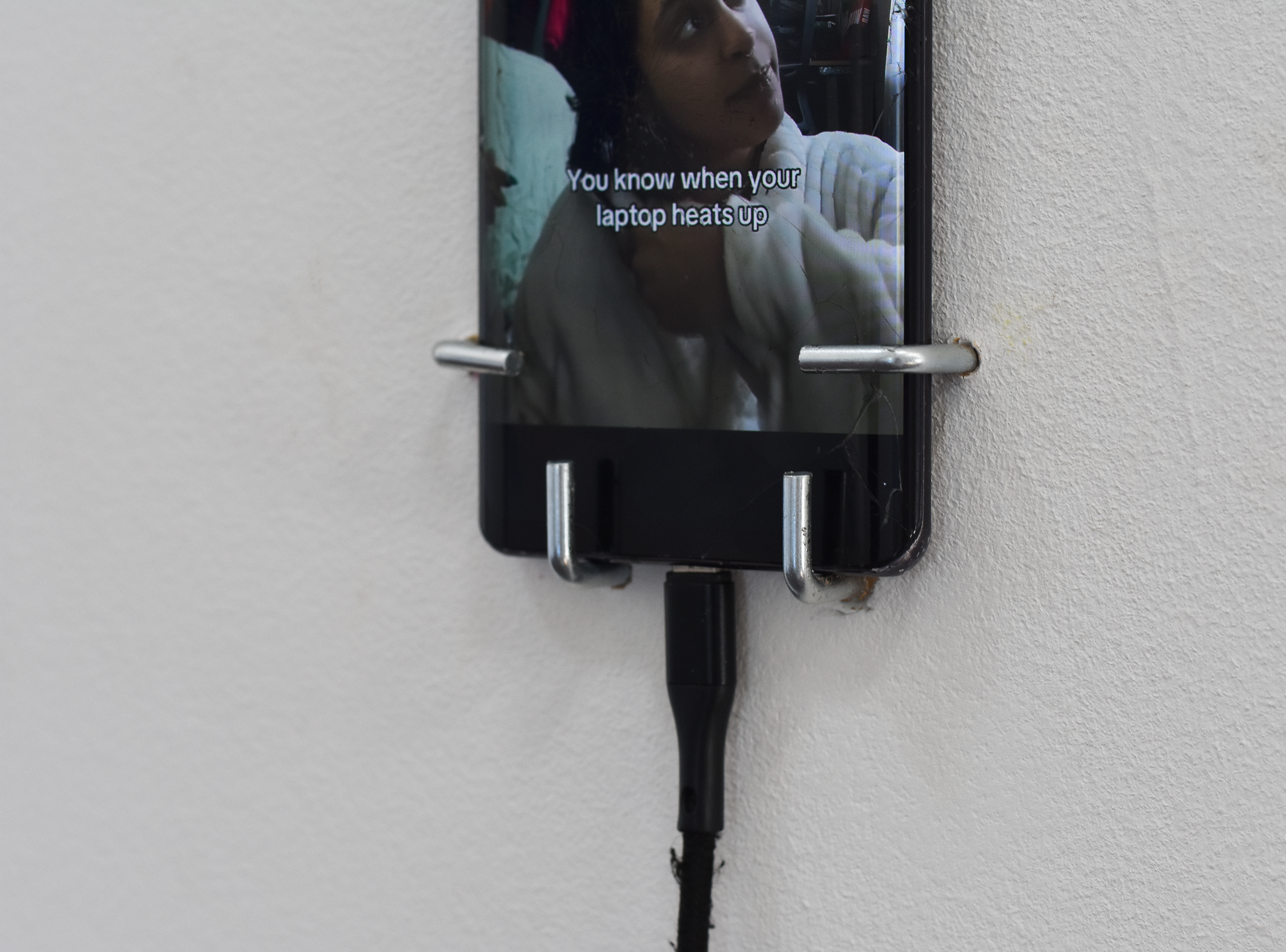 Closeup of smartphone on wall.