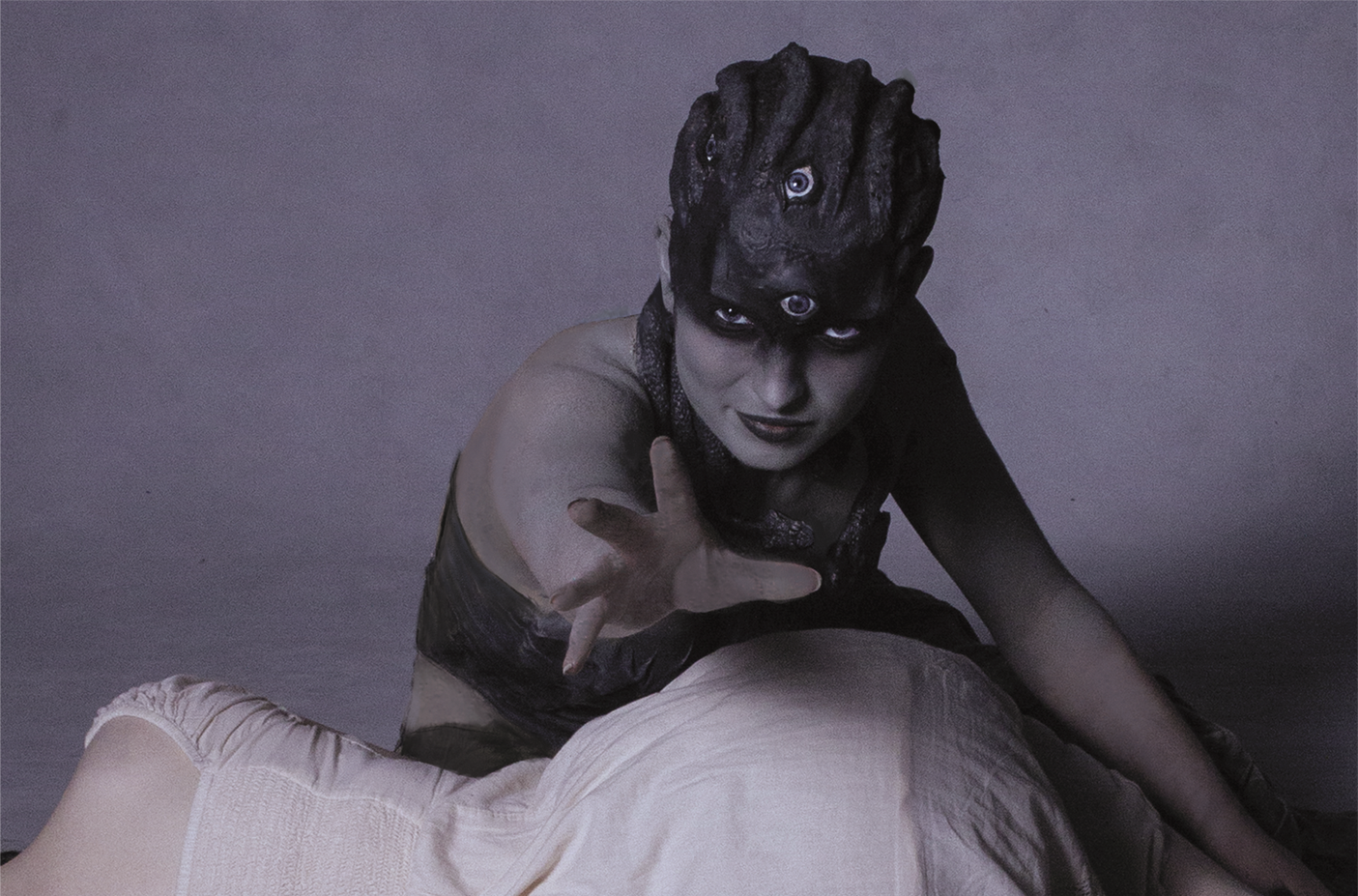 Medusa is stretching her hand towards man tempting to catch him.