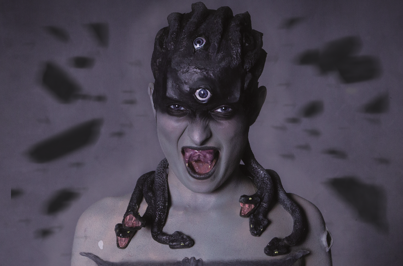 Medusa turns man into stone and he collapses into pieces.