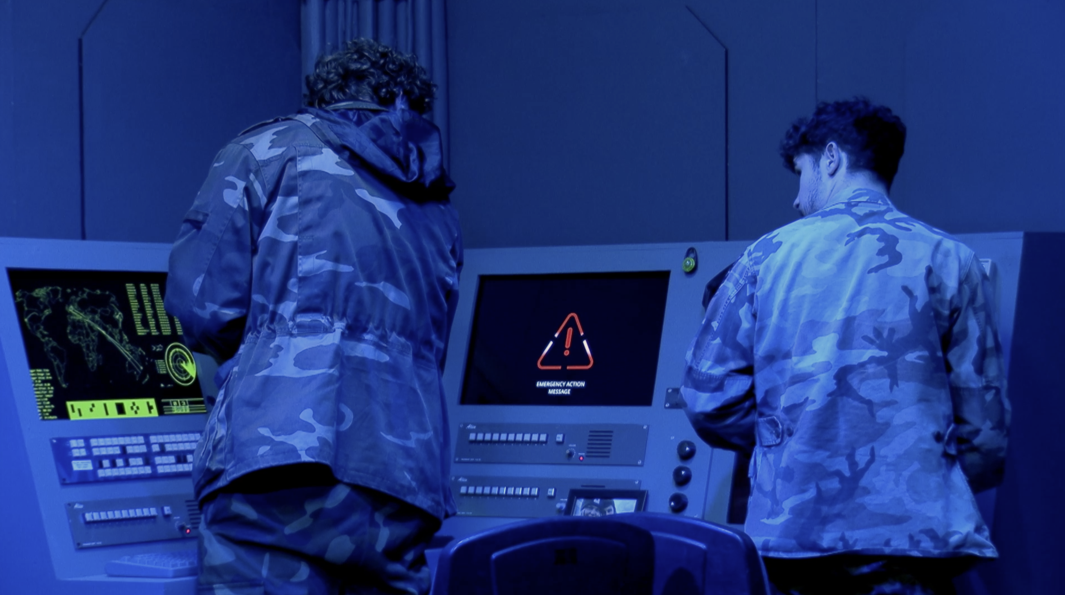 Zach and Kyle standing at the control desk