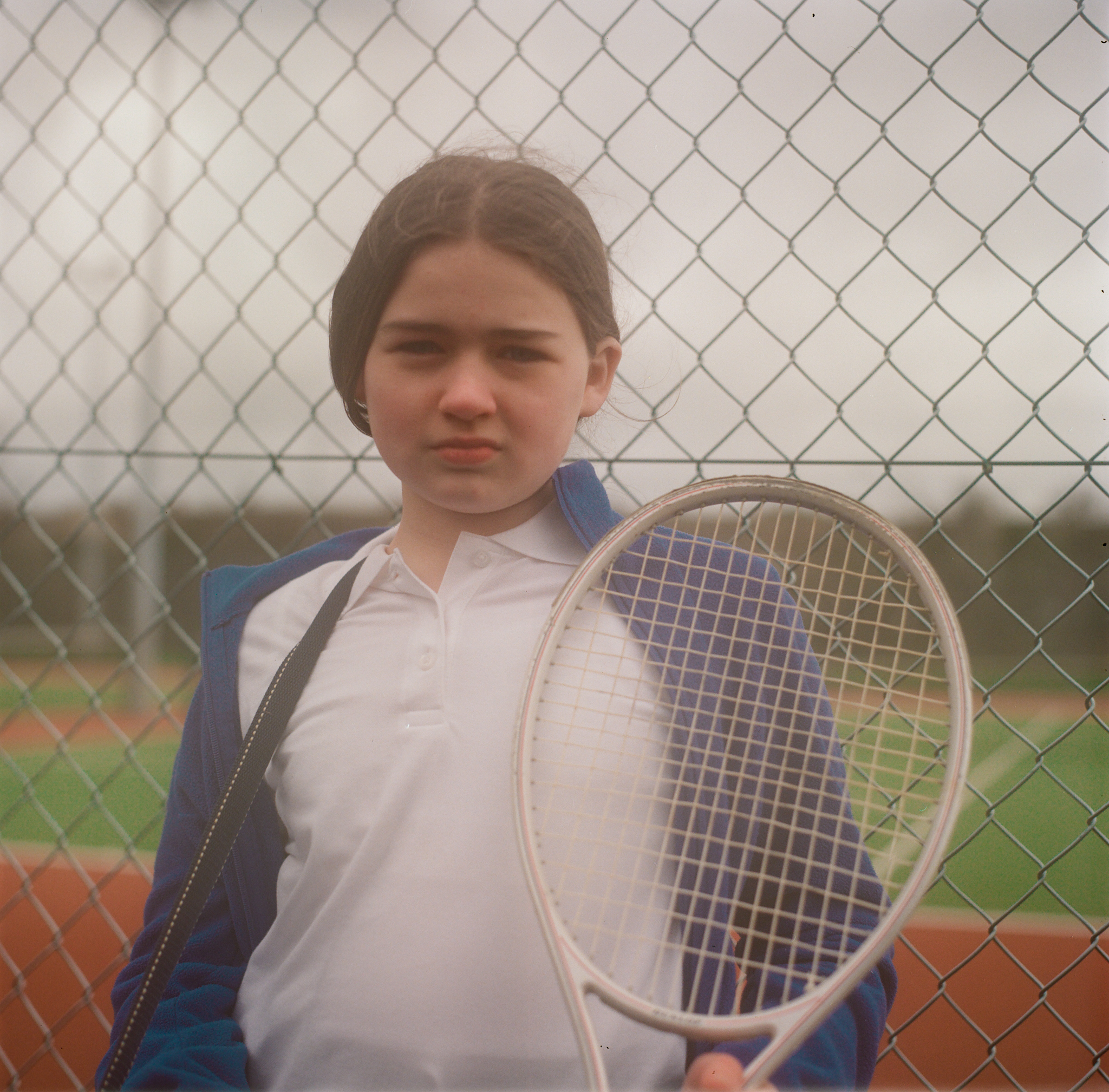 girl holding tennis racket