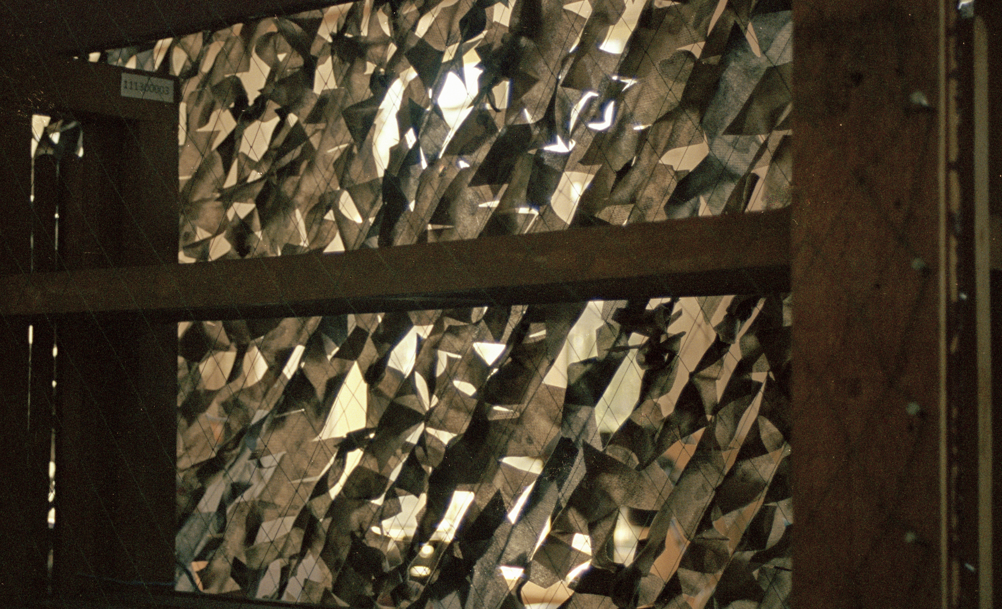 Camouflage net on the frame.
