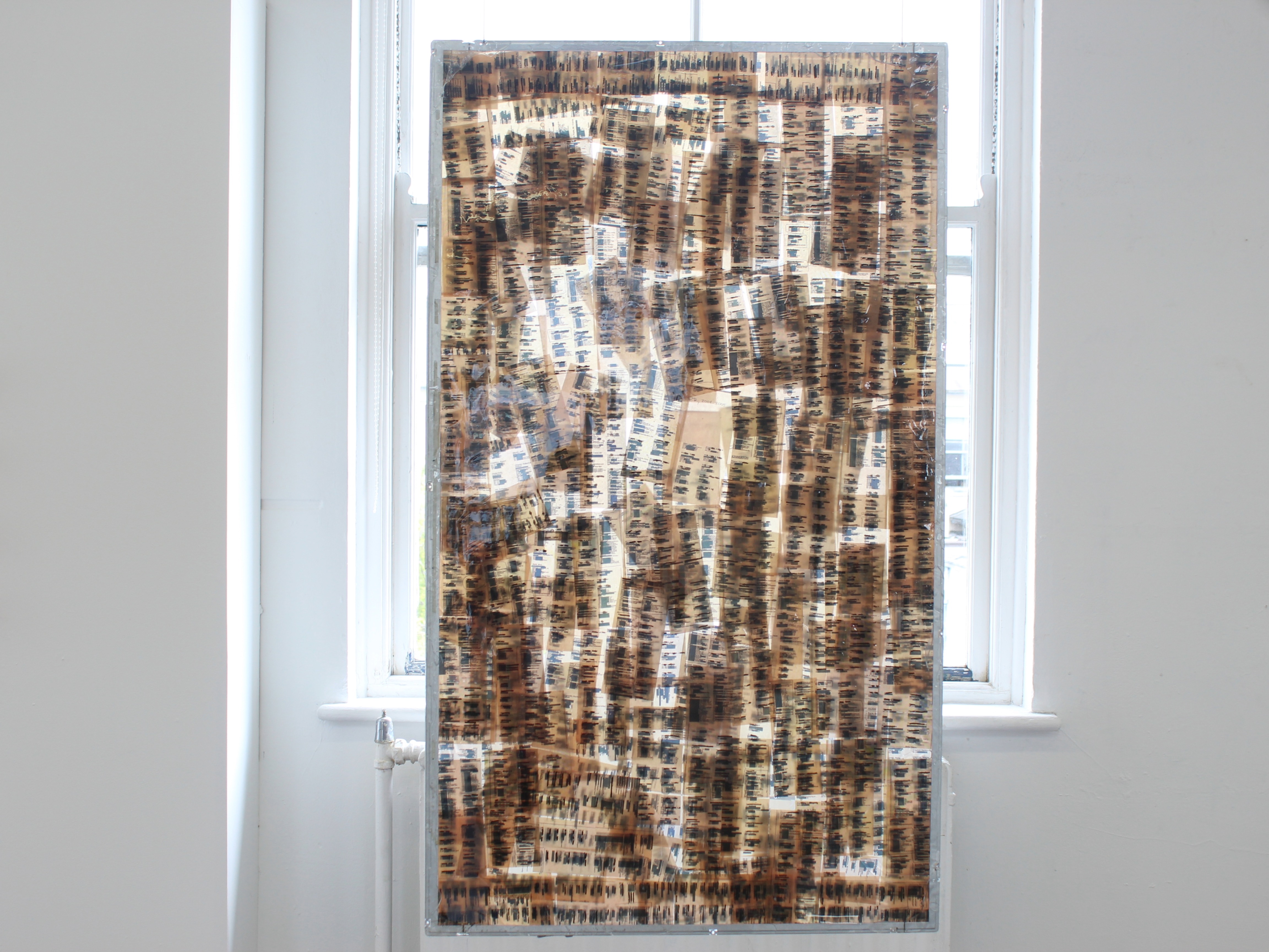 Marie Noonan,**R_dact_d**,2026.Paper,EpoxyResin and TV cage.