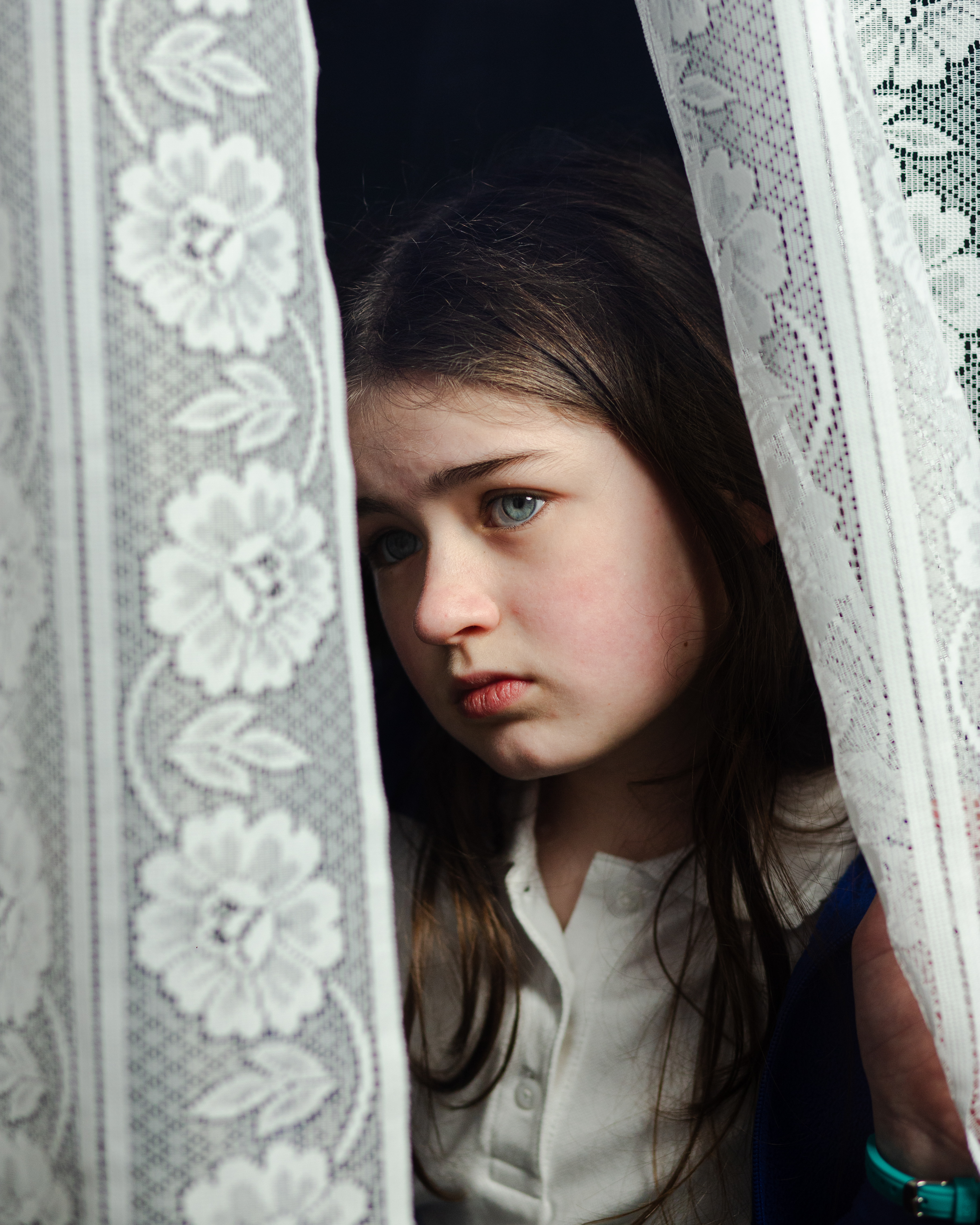 girls looks out of window