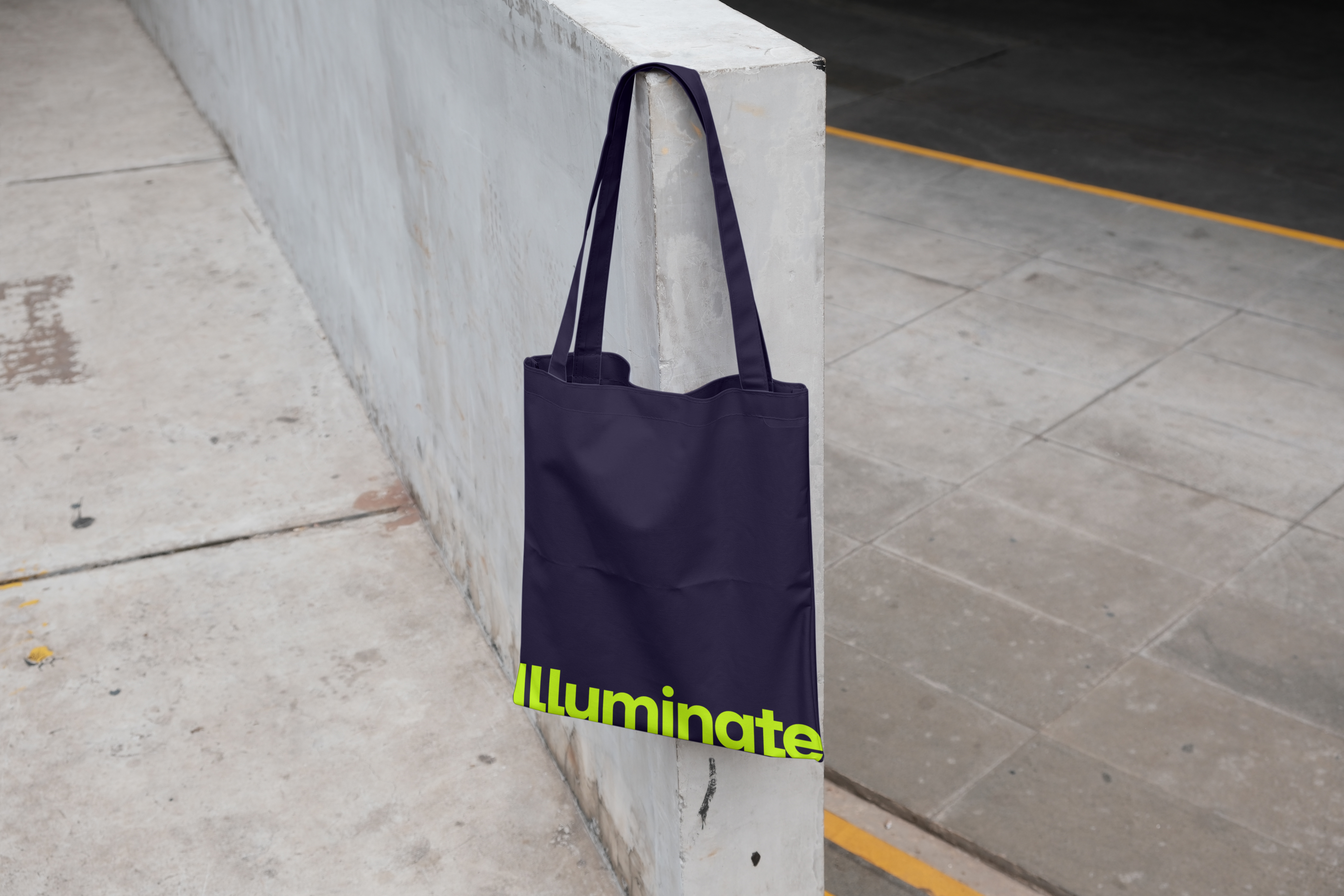 blue tote bag with illuminate written on it in neon yellow