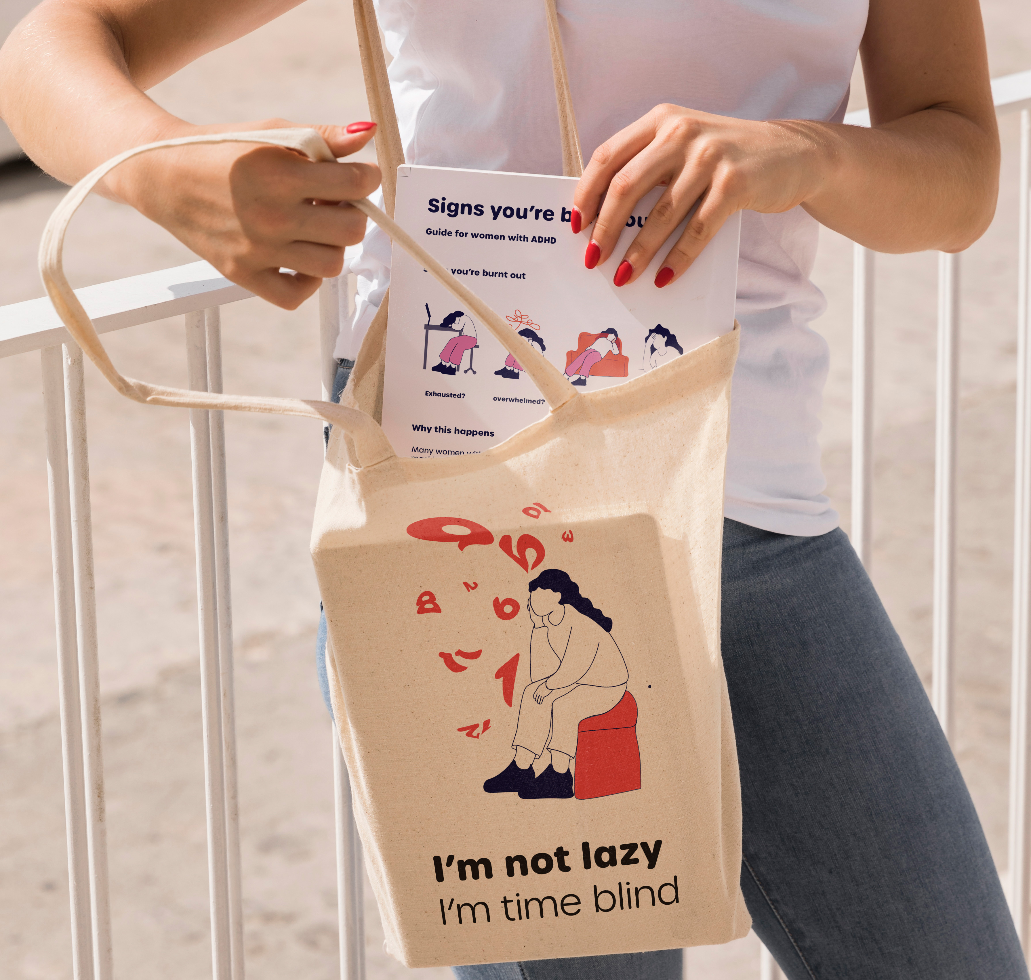 Tote bag and printed guide featuring burnout awareness messaging designed to support women with ADHD.