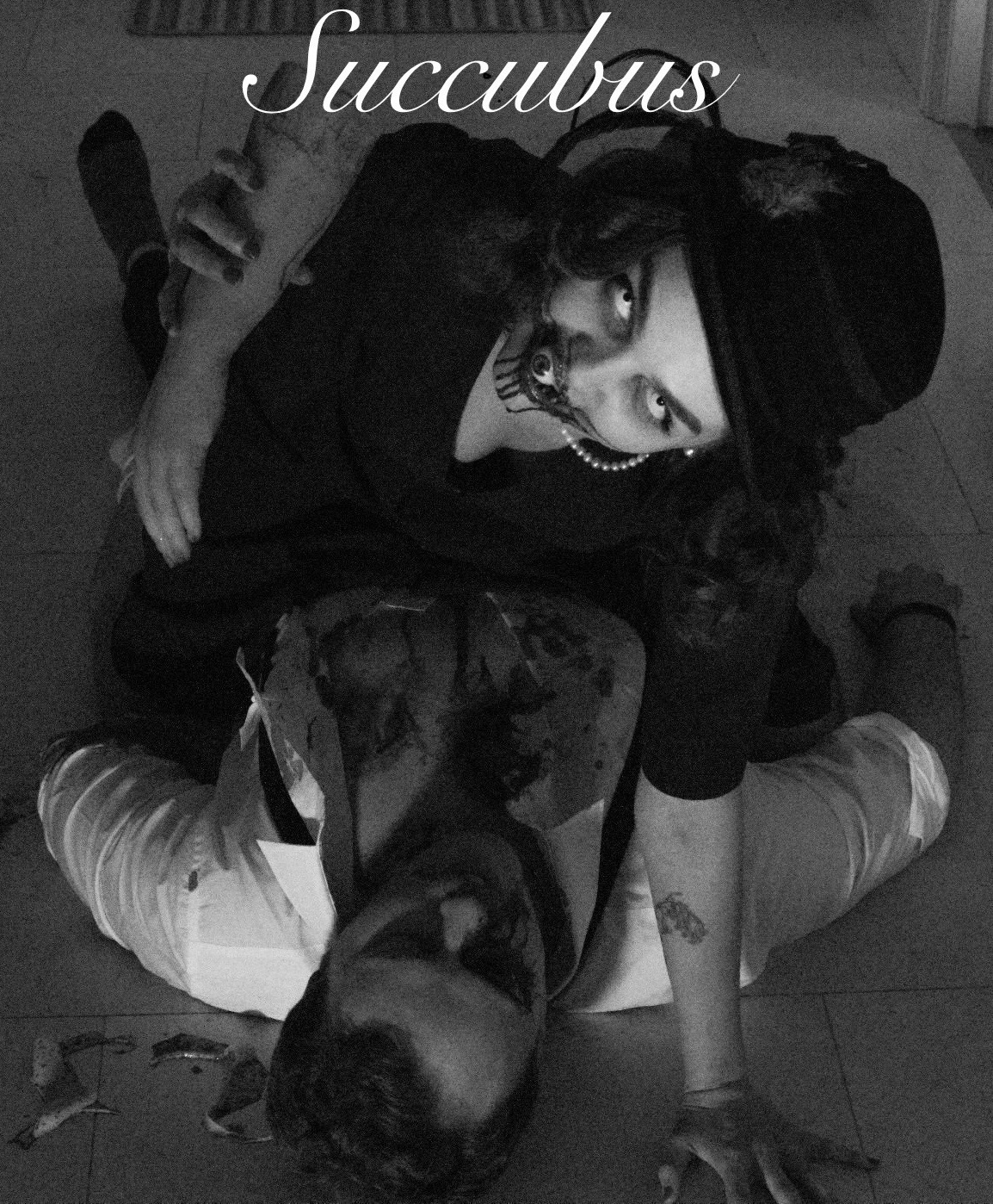 At the beginning of this project this is the image I pictured first. The succubus looking into the lens while eating his body