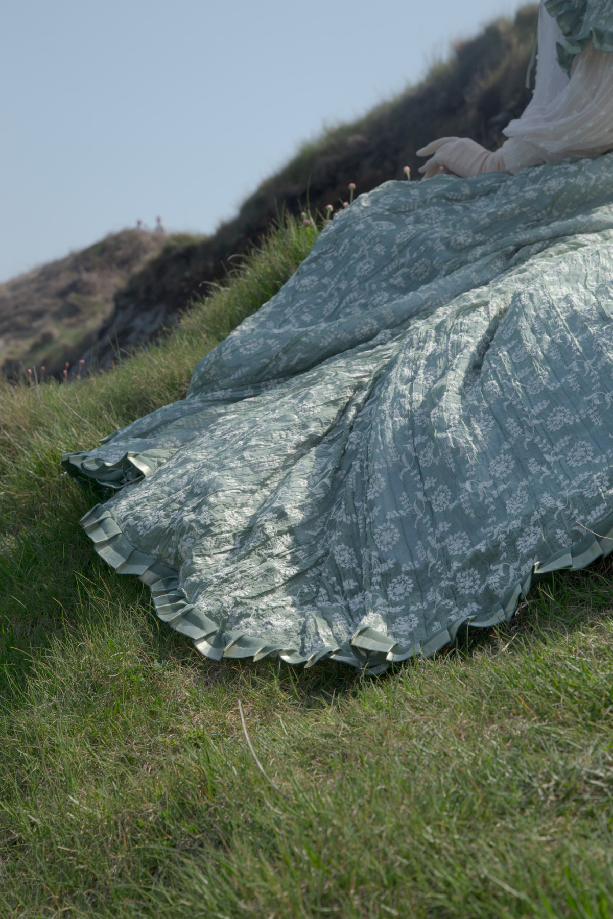 detail of pleats on skirt hem
