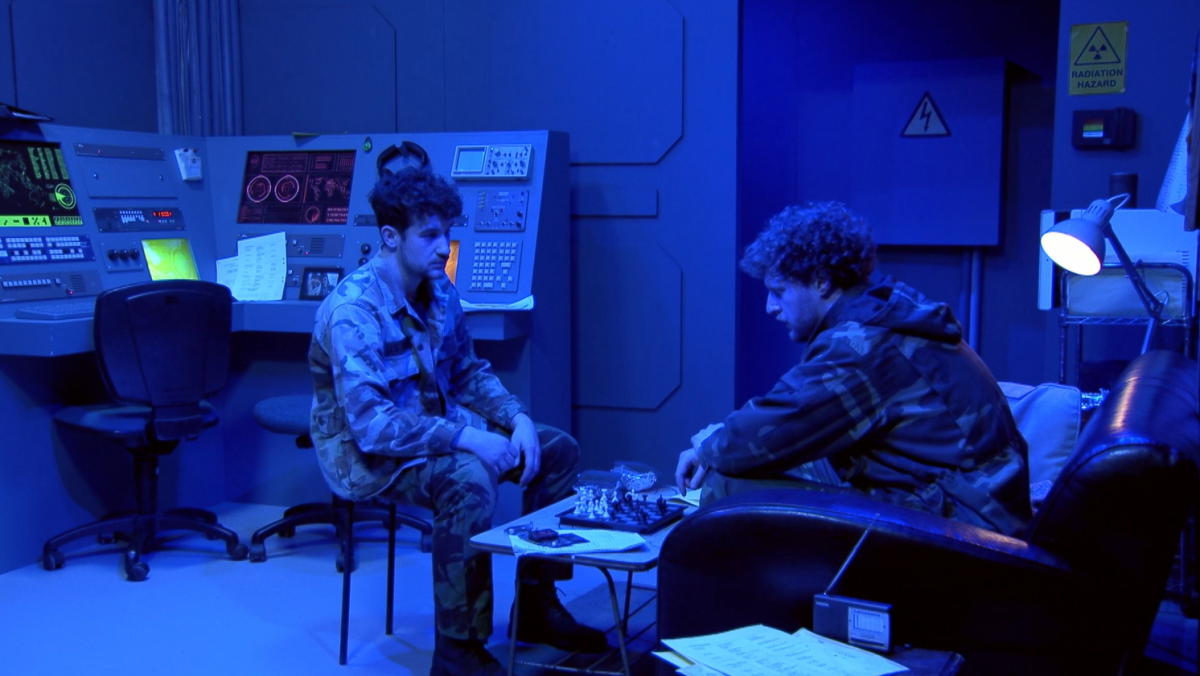 Movie still from the silo set from City Upon a Hill, showcasing the military style bunker.