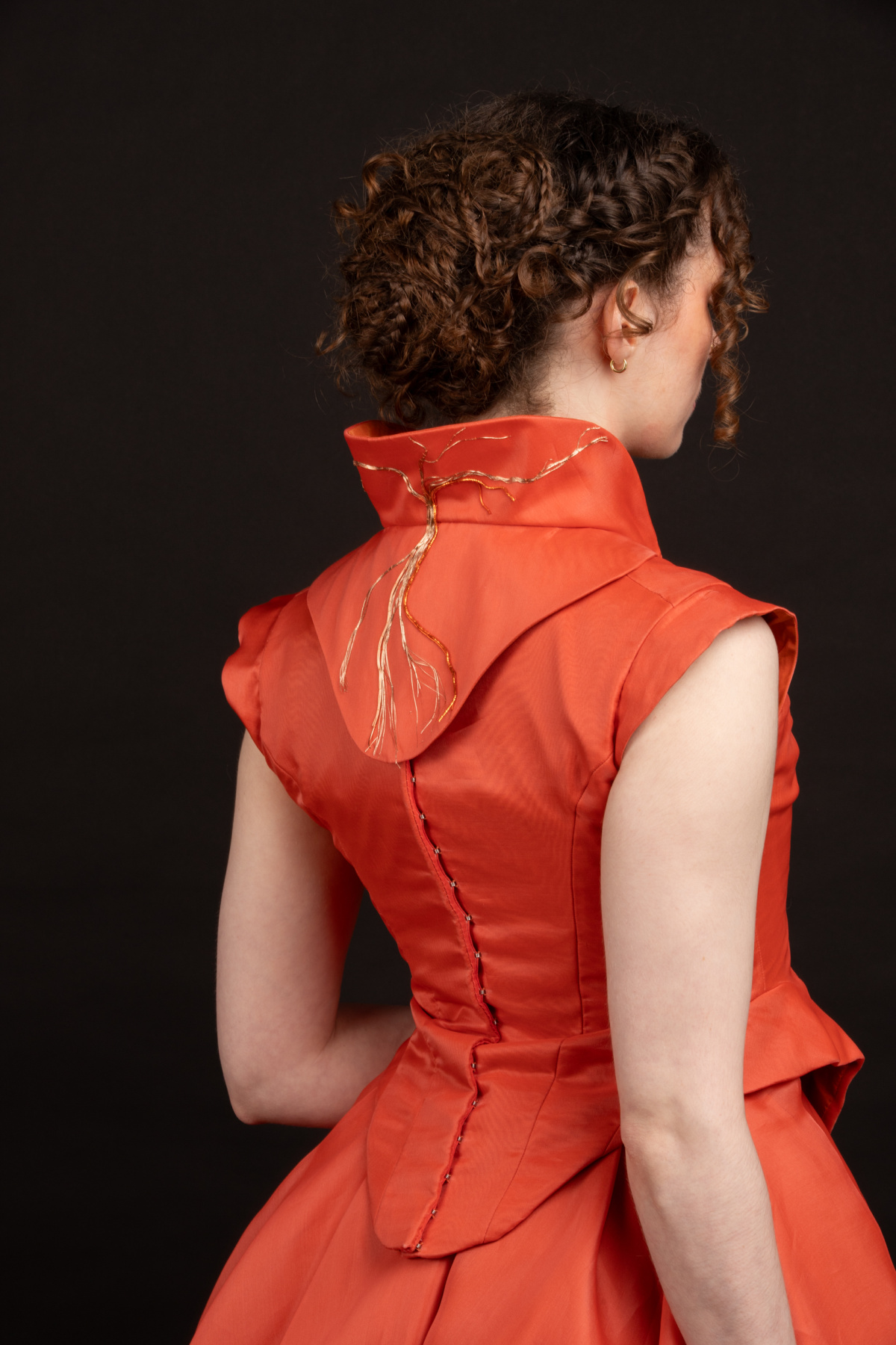 Dress from the back with embroidery on the collar
