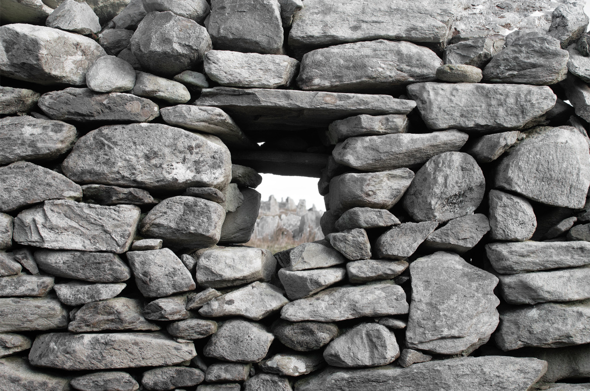 A stone wall with an opening for a window