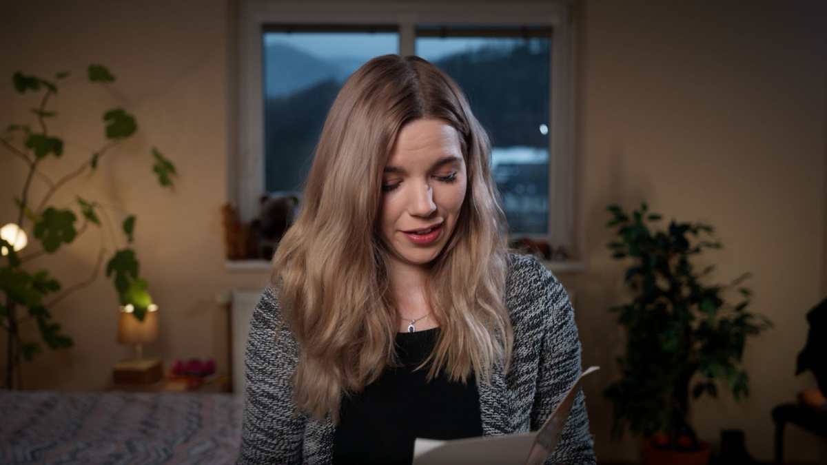 Anna reading out cards from past clients wishing her well after leaving the Irish sex industry behind her