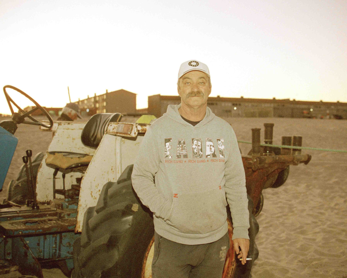 Portrait of a Fisherman called Zé, he is seen smoking a cigarette while pulling the fishing nets with a tractor.