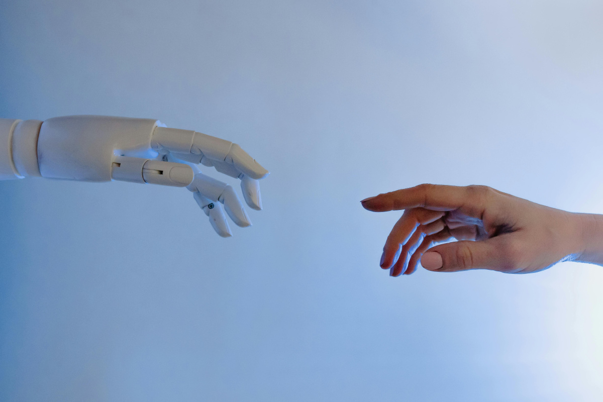 Human and Robot hand almost touching