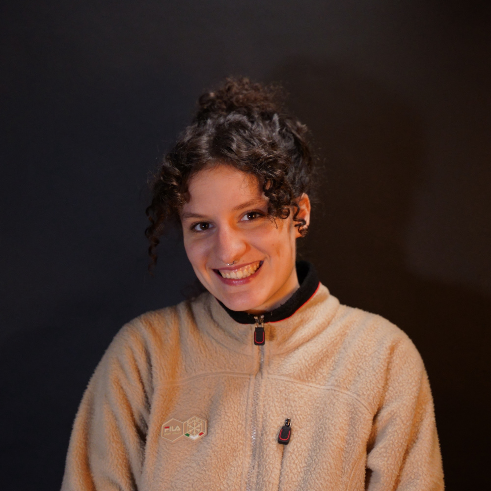 Headshot of Orla smiling into the camera.