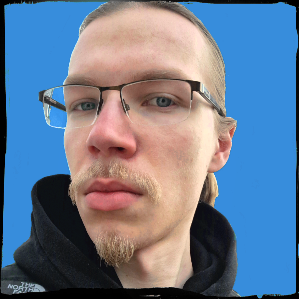 Blonde guy wearing glasses with facial hair